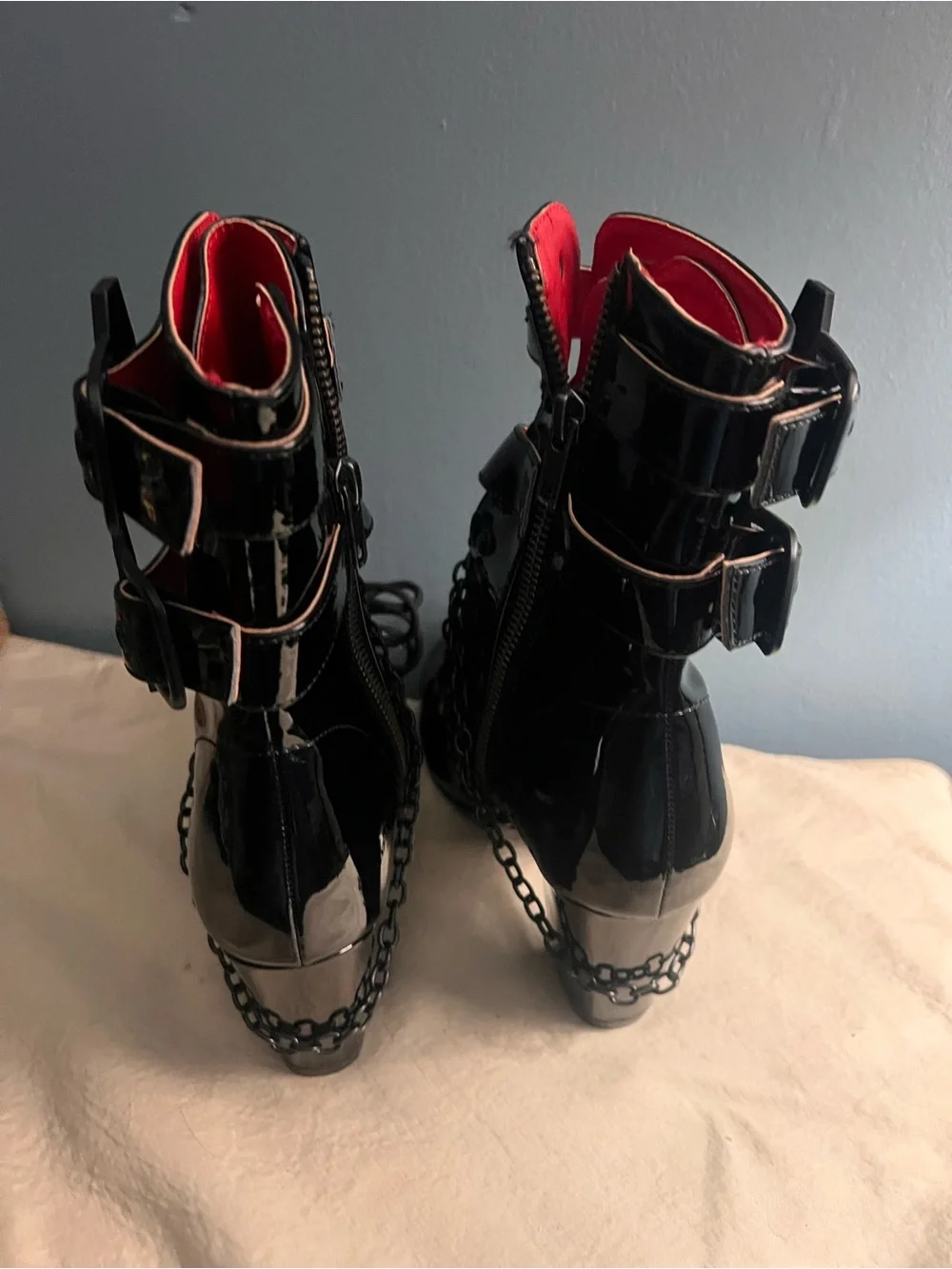 Demonia Women’s Black Patent Chain-Accent Ankle Boots